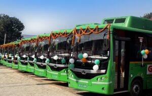 A fleet of green coloured electric buses in Guwahati, India